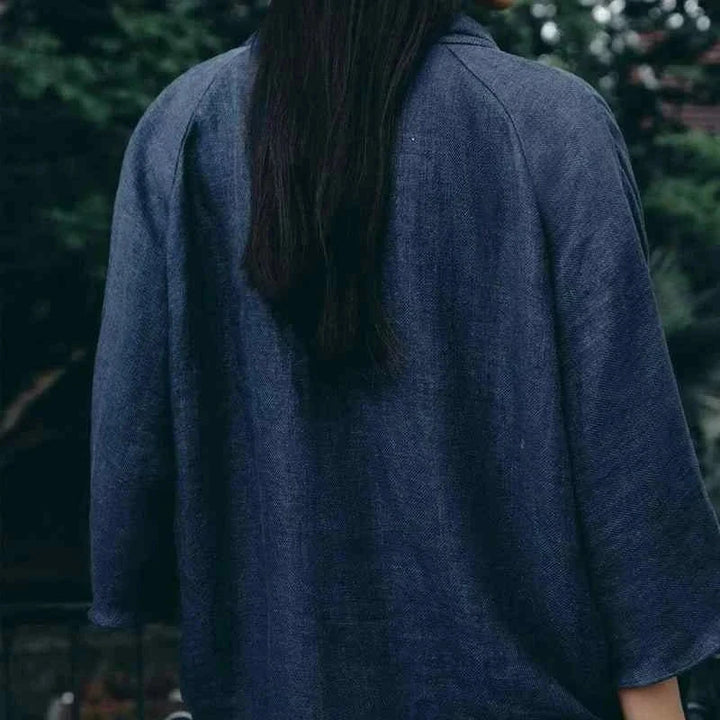 woman wearing loose dark linen shirt and pants outdoors summer women's clothing for summer