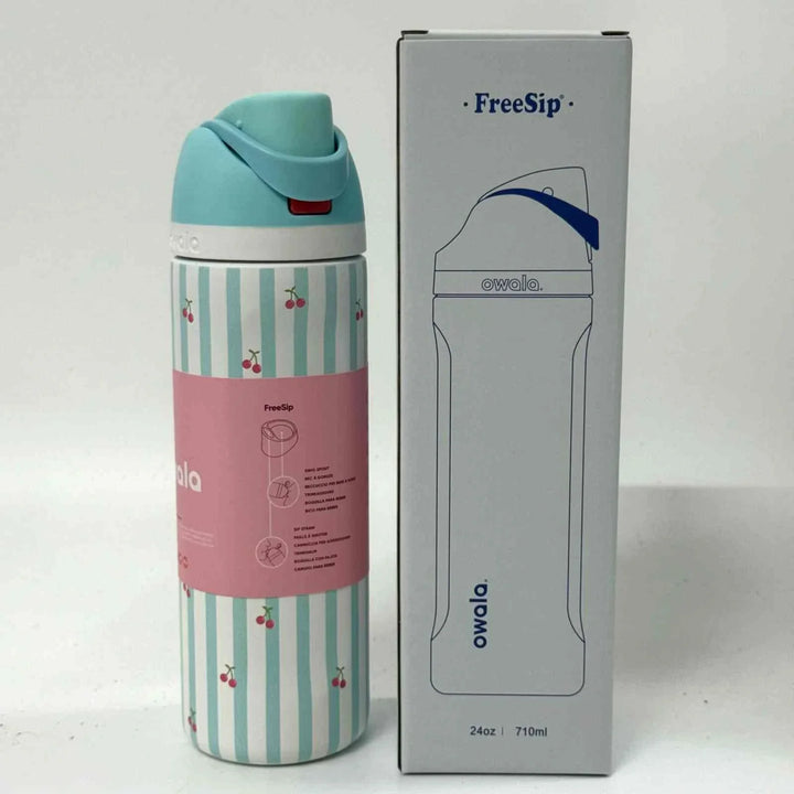 Owala FreeSip stainless steel water bottle with dual spout, leak-proof design, and cherry stripe pattern next to product box