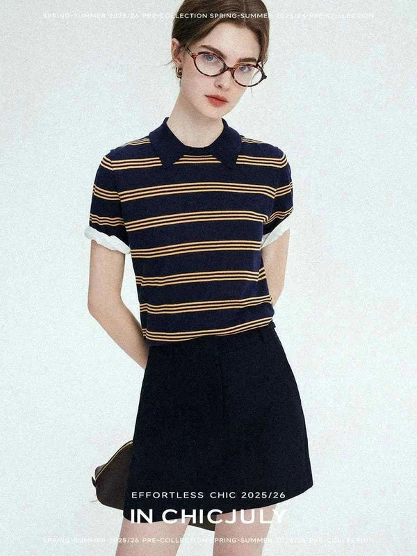 Woman wearing CHICJULY navy blue striped polo shirt with short sleeves and a black skirt casual spring summer outfit 2025/26