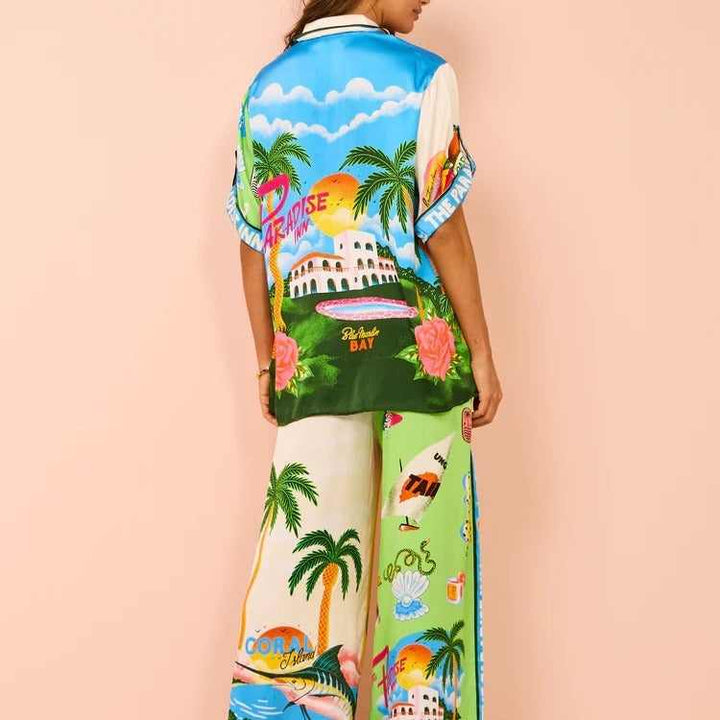 Colorful European and American resort casual tether set with tropical print, featuring short sleeves and a color-blocked design.