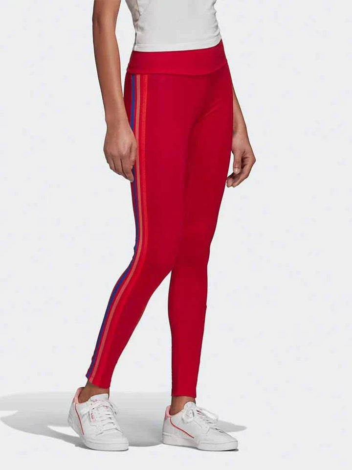 Red Adidas leggings with colorful side stripes, slim fit, and original Adidas logo.