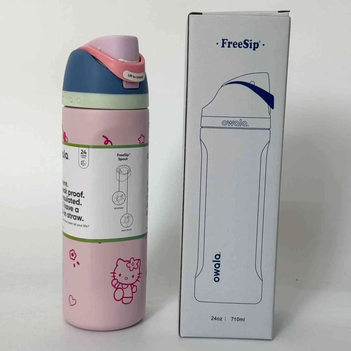 Owala FreeSip pink stainless steel water bottle with dual spout and leak-proof design next to white packaging box