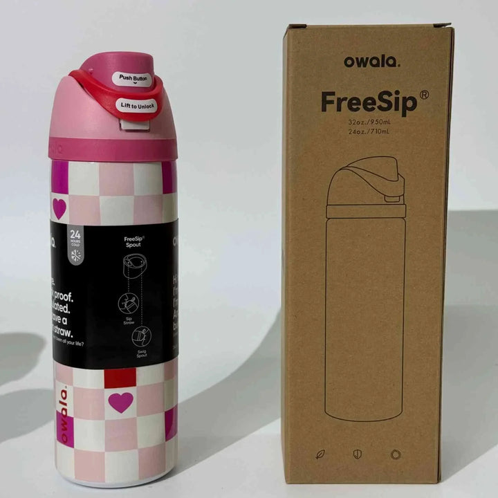 Pink and white checkered Owala Thermos CupKitty Limited Edition with spill-proof cap and FreeSip technology next to its cardboard packaging box