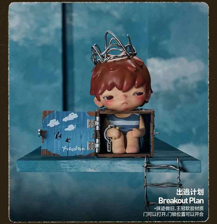 POPMART Hirono Echo Series figure in a cage with brown hair, wearing a blue outfit, on a blue background.