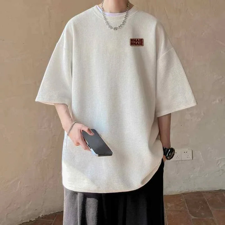 White MORRYING t-shirt with loose fit and cartoon character print, casual and comfortable design.
