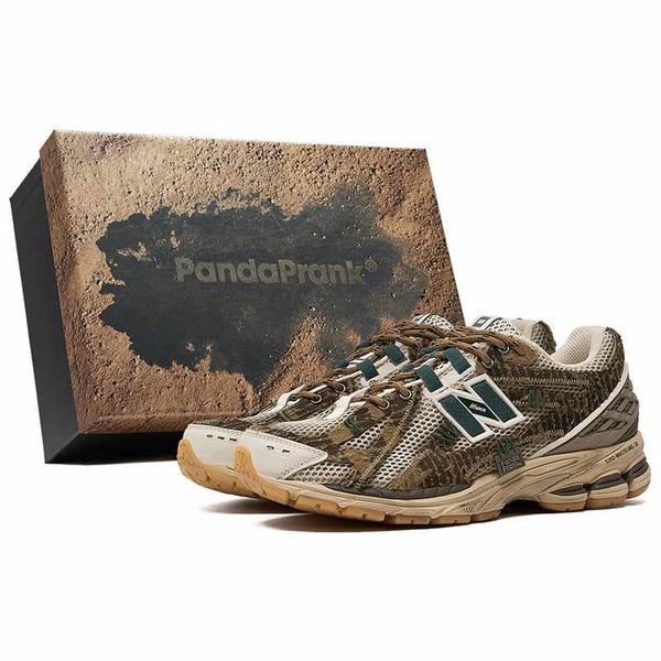 New Balance 1906R PandaPrank Wasteland limited edition sneakers with earthy camo design and durable mixed materials next to matching themed box