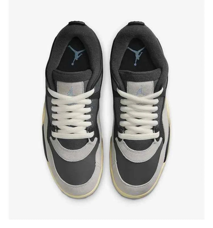 Air Jordan 4RM sneakers in Iron Gray, Chambray, and Off Noir, top view.