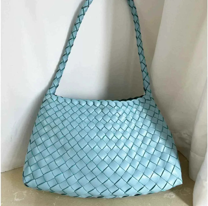 Light blue dragon woven bag made from premium cowhide leather with a braided design and comfortable shoulder strap.