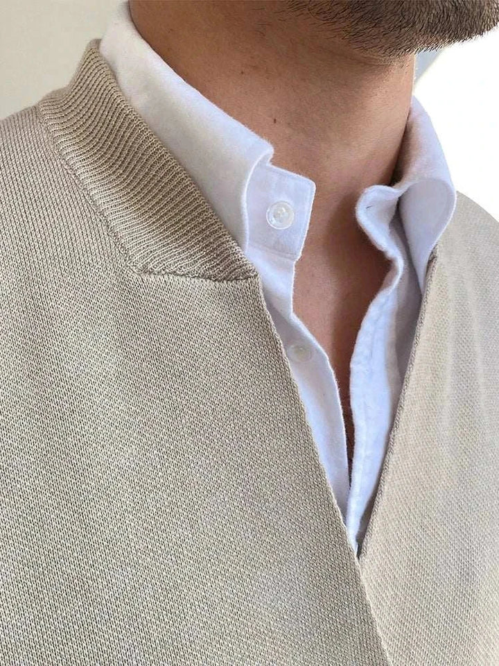 Mr. Lusan's British slim fit wool vest in beige close-up showing knitted texture and collar detail