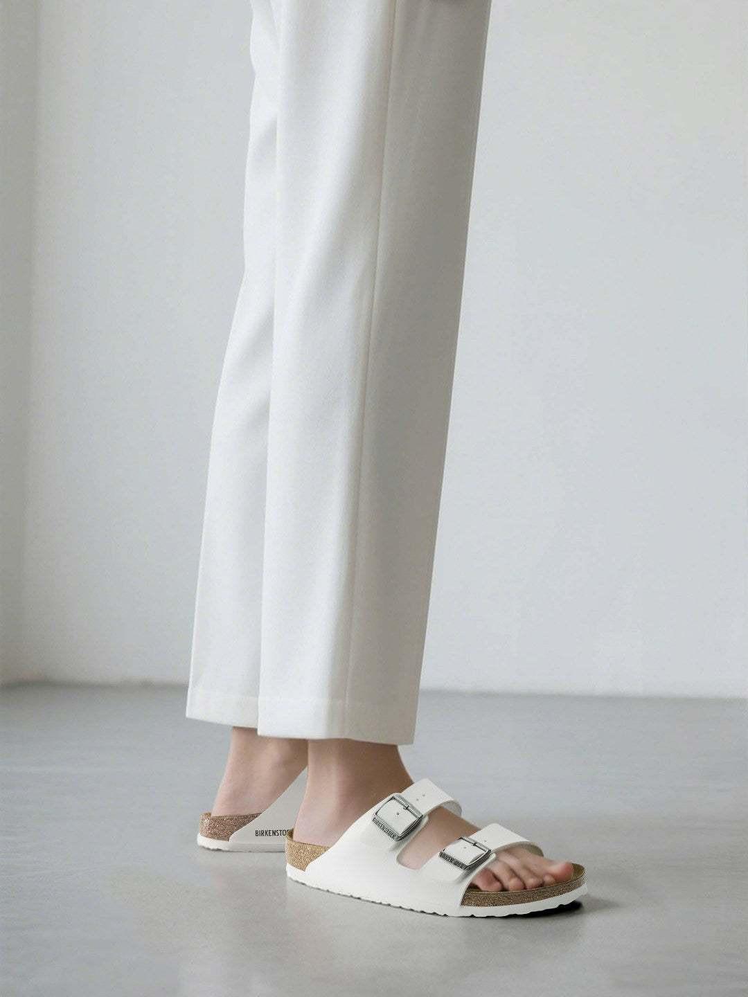BIRKENSTOCK  Arizona double-buckle slippers.