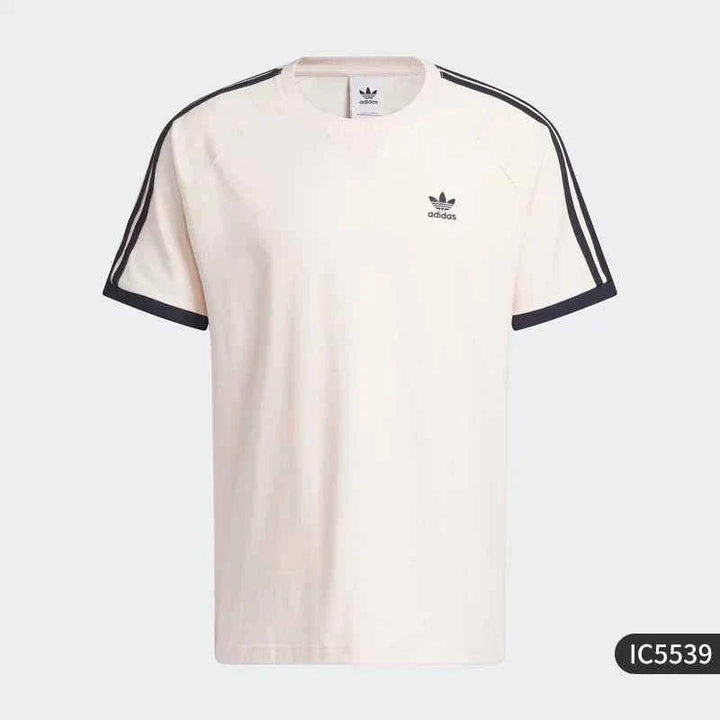 Adidas pink casual t-shirt with Trefoil logo and black stripes on sleeves