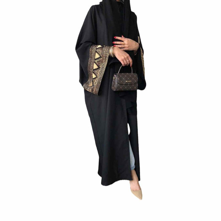 Elegant embroidered abaya with wide sleeves and geometric designs, perfect for all occasions.