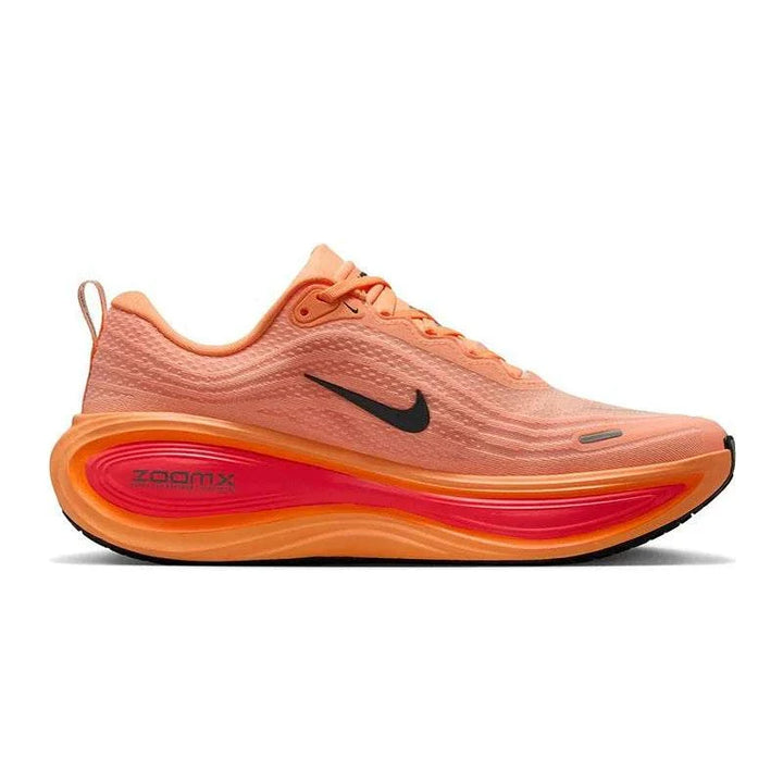 Nike VOMERO PLUS men's road running shoe in coral orange with black Nike logo and ZoomX cushioning.