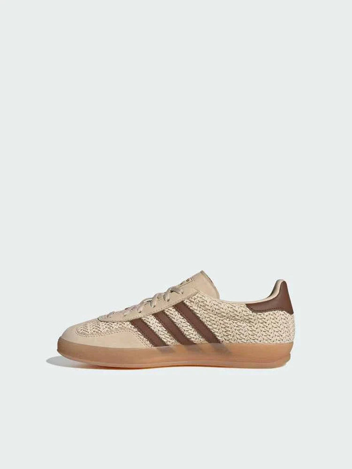 Beige and brown Adidas Originals Gazelle Indoor shoe with leather and canvas upper and honey-colored transparent sole.