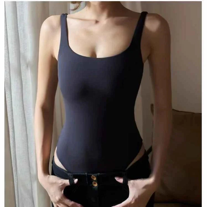 Black seamless SKIMS Kardashian بودي سكوب ثونغ bodysuit with scoop neck and thong back, ideal for smooth fit under clothing