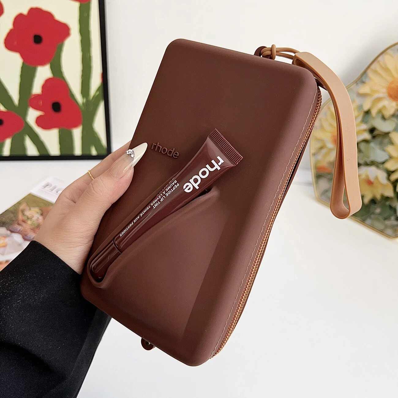 Rhode bag with Peptide Lip Tint lip balm in various designs and