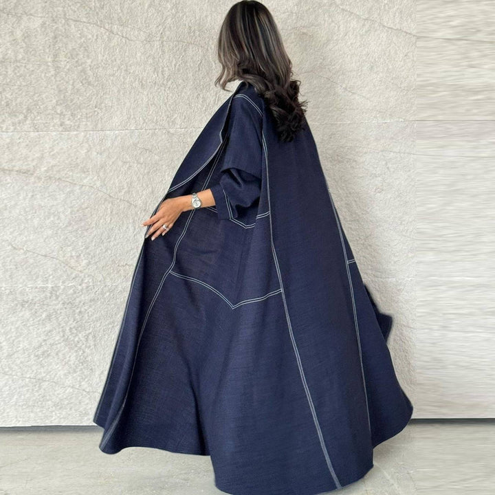 Dark navy abaya with elegant ruffle, loose sleeves, and modern stitching for a sophisticated look.