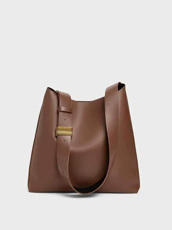 brown CHARLES & KEITH shoulder bag with wide adjustable strap and magnetic closure