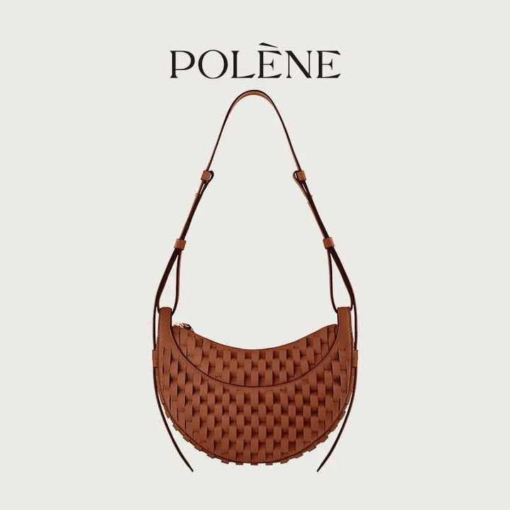 Polène Numéro Dix handmade woven leather shoulder bag in cognac color with curved crescent design.