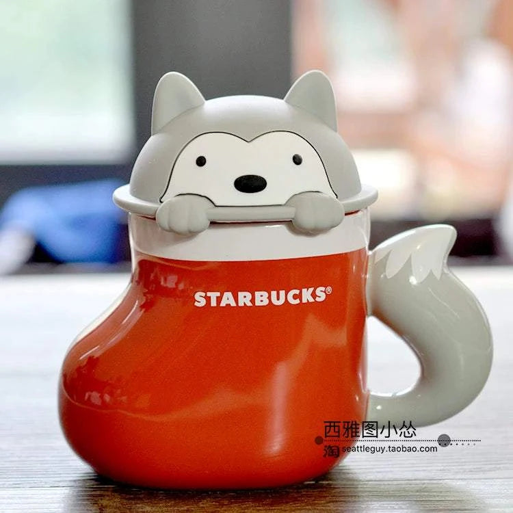 كوب Starbucks سيراميك بتصميم ثعلب باللون البرتقالي.