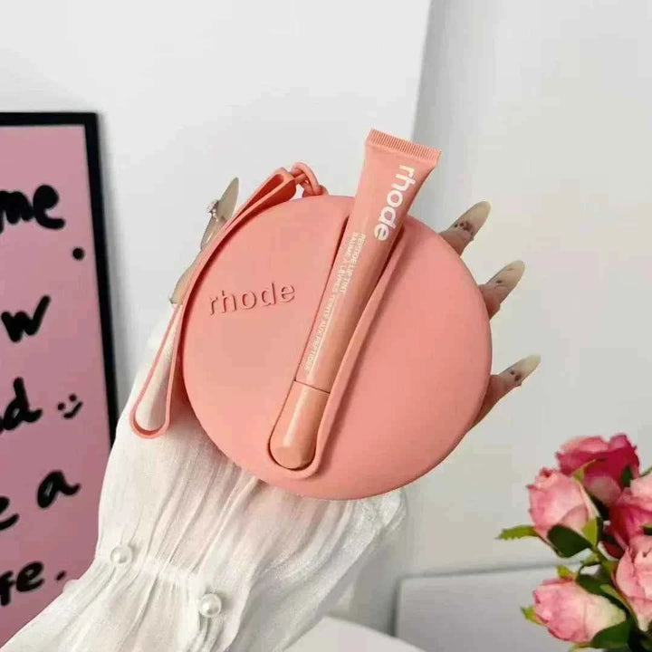 Rhode Peptide Lip Tint with matching round silicone pouch in peach pink shade for deep hydration and natural glossy color.