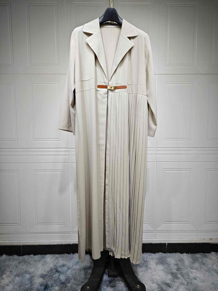 Luxury pleated coat with side details, long classic design, beige color, golden buckle belt.