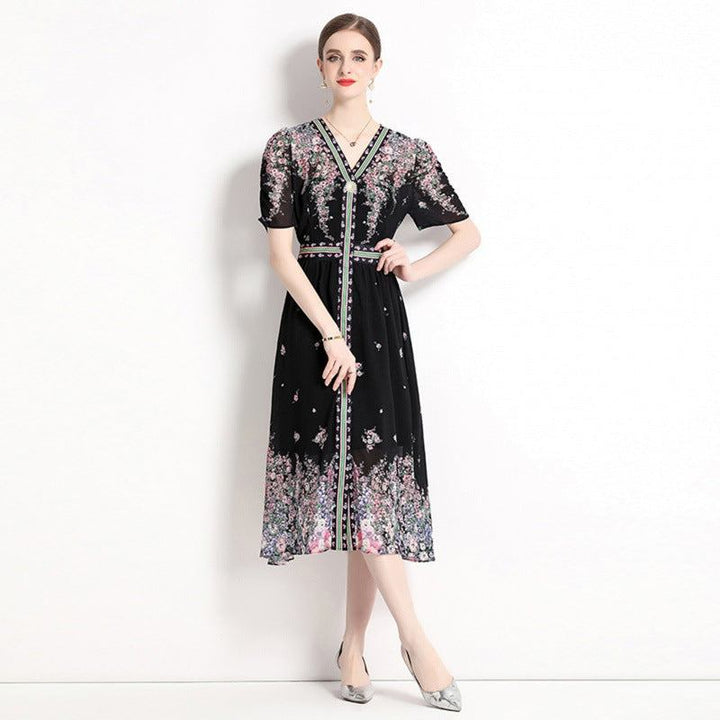 Elegant black chiffon dress with floral print and stylish design, 2024 summer fashion.