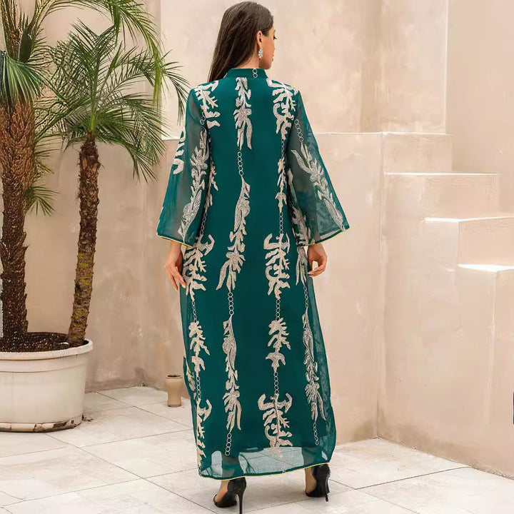 Dark green dress with luxurious gold and silver embroidery, featuring a loose fit and wide sleeves, perfect for evening and Ramadan events.