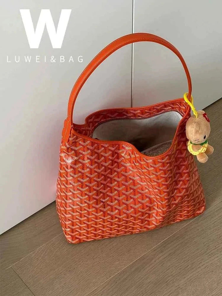 orange hobo bag with geometric pattern and leather shoulder strap for daily use