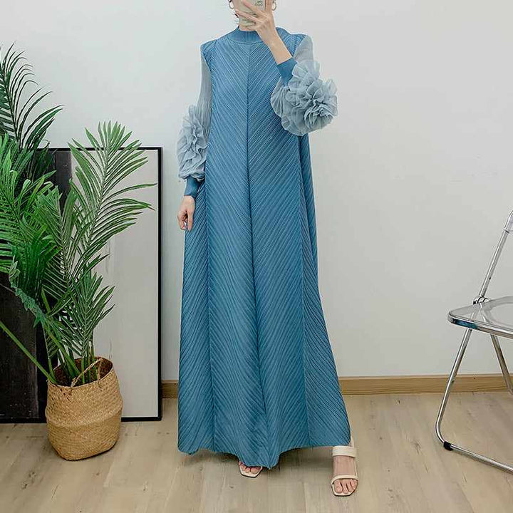 Elegant solid color long dress with floral sleeves, pressed pleats, and a loose fit.