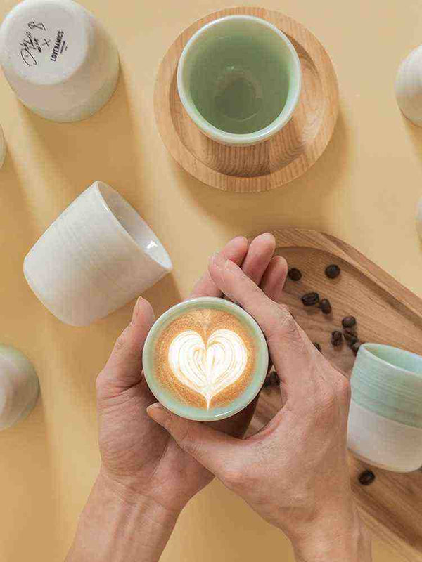 Atoma co-branded Loveramics European style ceramic coffee mug with latte art.