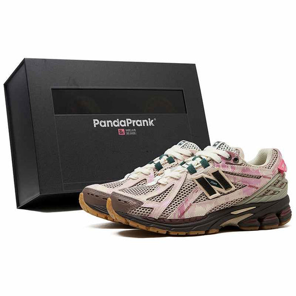 Limited edition New Balance 1906R PandaPrank sneakers in beige and pink with green accents and exclusive packaging.