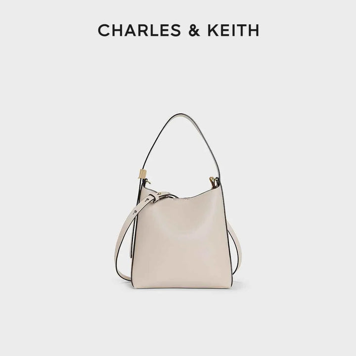 Small beige leather shoulder bag with matching wallet by CHARLES & KEITH, elegant and compact design