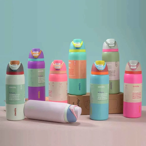 Owala FreeSip stainless steel water bottles with dual spout design, leak-proof, BPA-free, and insulated for 24-hour cold retention in various pastel colors