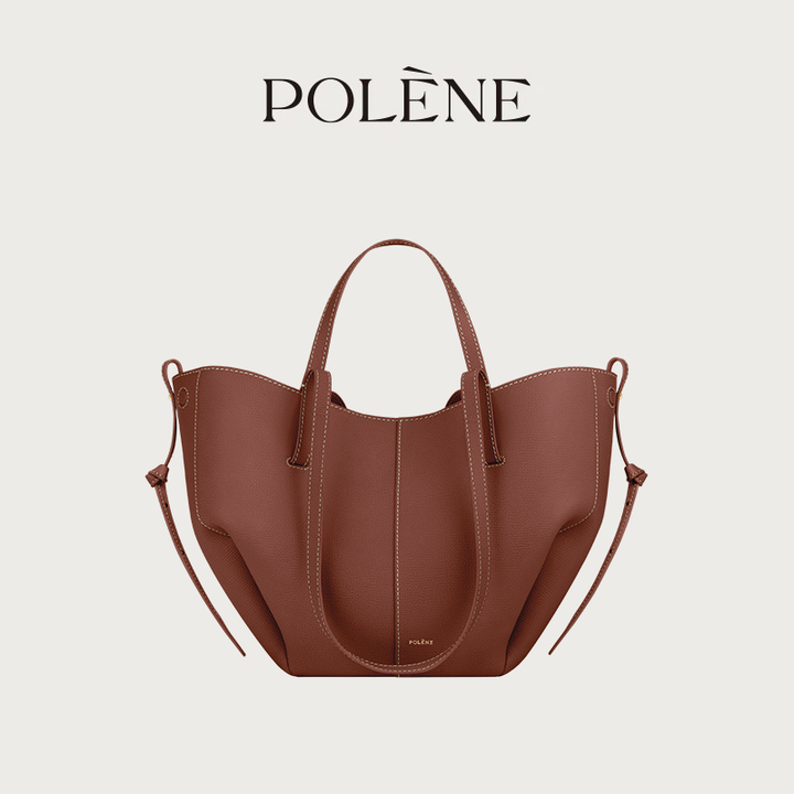 Polène Cyme Mini brown leather tote bag with soft curves, dual shoulder straps, and removable inner pouch.