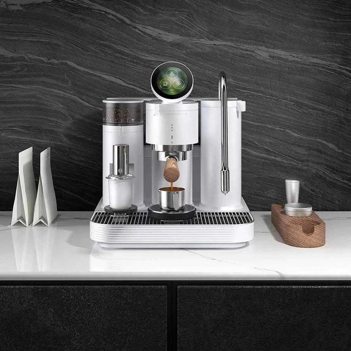 Dual boiler espresso machine on counter with smart touch interface.