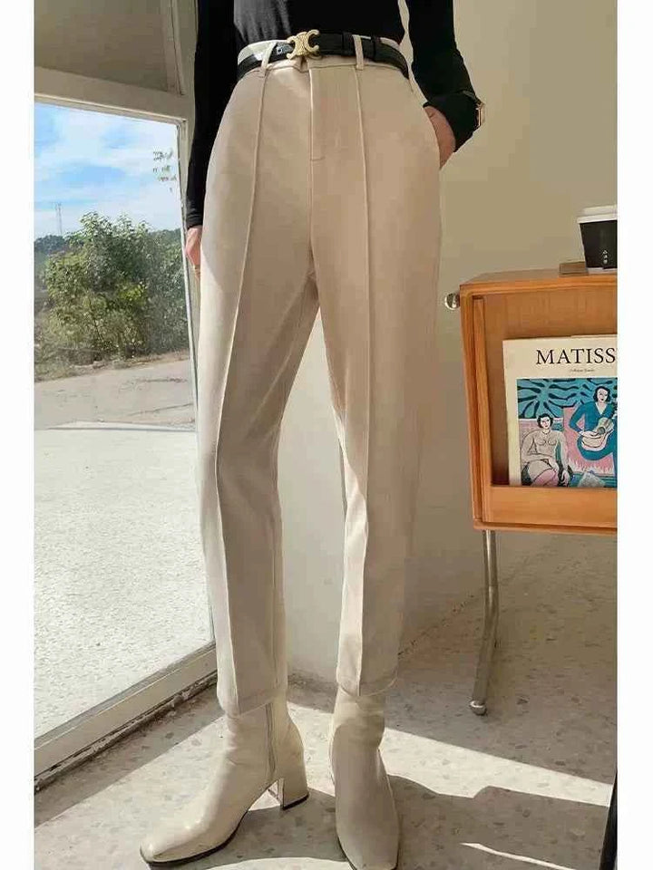Beige classic cut formal pants for women with a comfortable fit and luxurious fabric, ideal for office and elegant occasions.