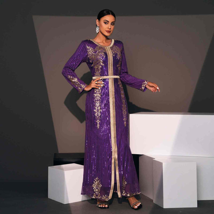 Luxurious Moroccan caftan in deep purple with elegant gold embroidery and a shiny fabric, featuring a thin gold belt; perfect for special occasions.