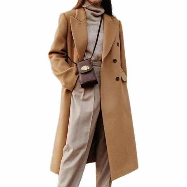 Classic winter coat with double buttons in camel color, styled with turtleneck and beige trousers