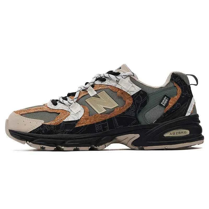 New Balance × PandaPrank limited edition sneaker with beige, olive green, black, and brown leather accents and ABZORB sole for shock absorption.