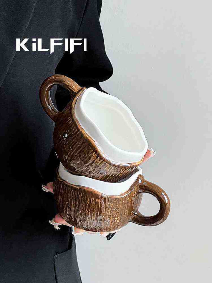أكواب خزفية بنية مع مقبض أبيض مصممة بشكل فني وعصري ماركة Kilfifi.