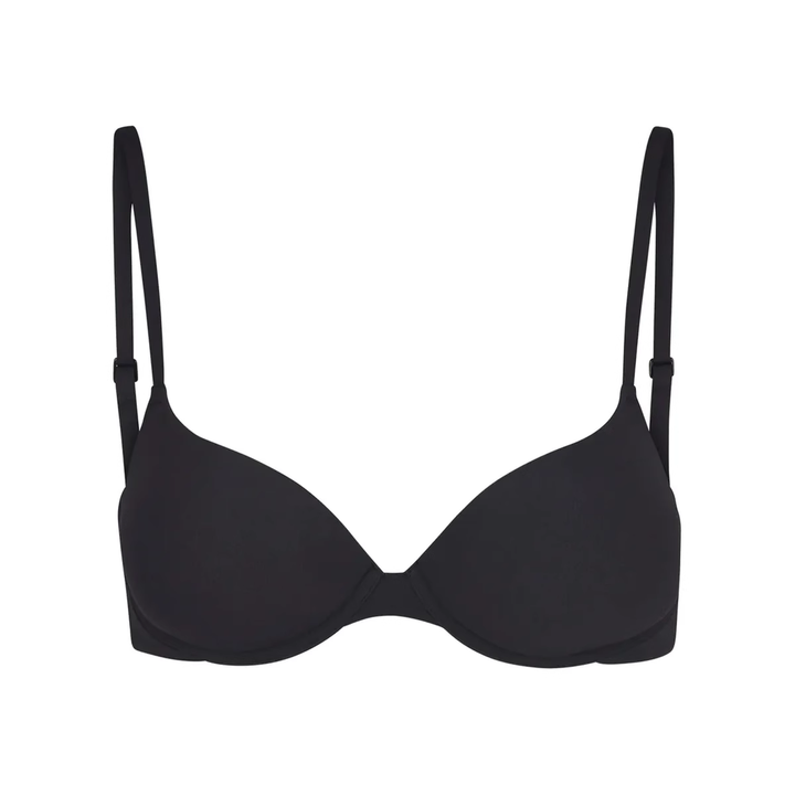 Soft supportive black bra with adjustable straps and seamless design by SKIMS.