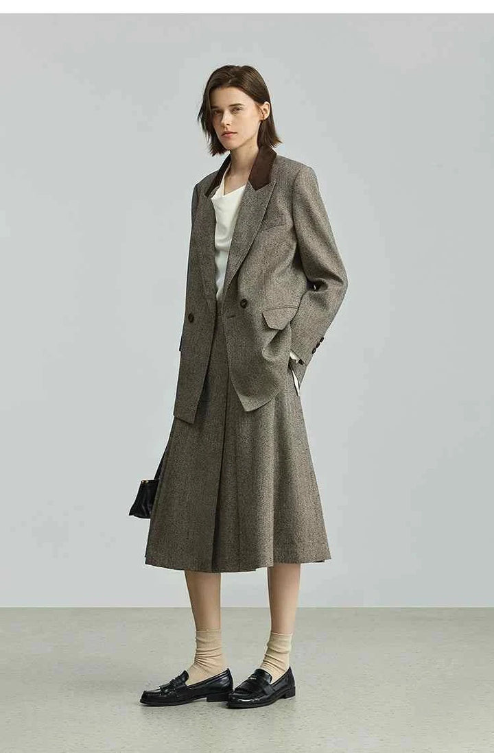 Woman wearing Elite suit LILY2025 retro corduroy high-end commuter suit jacket and matching skirt.