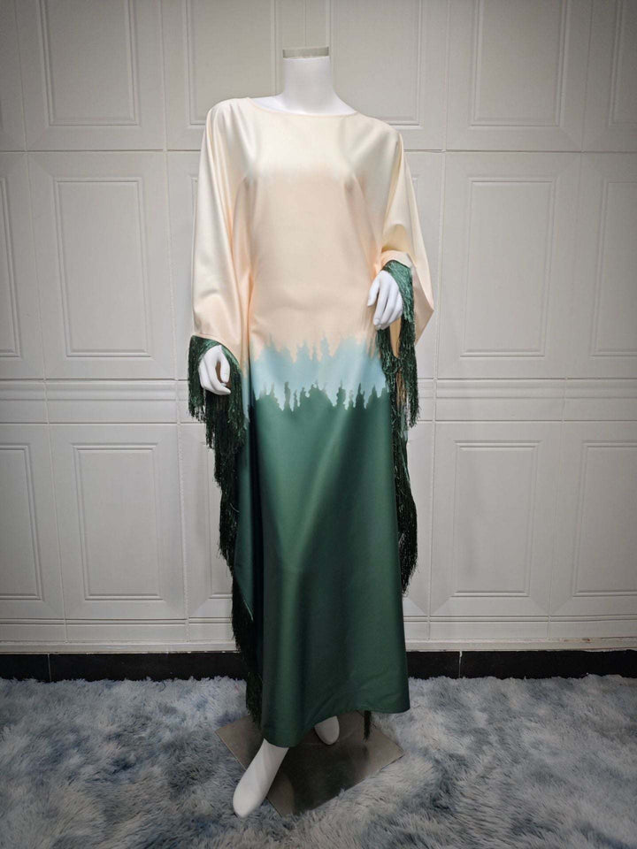 Satin dress with gradient print and tassel sleeves for elegant occasions.