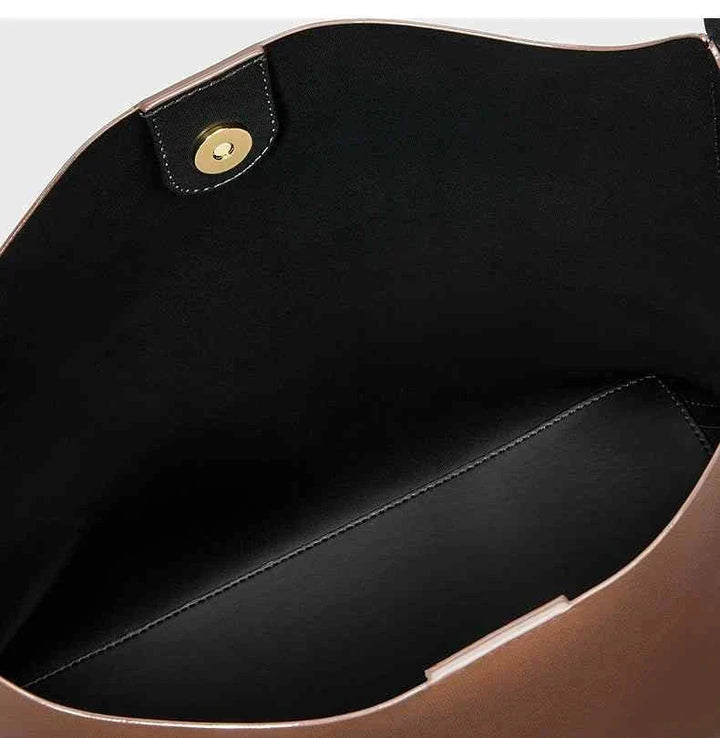 interior view of CHARLES & KEITH shoulder bag with wide strap and magnetic closure in brown color