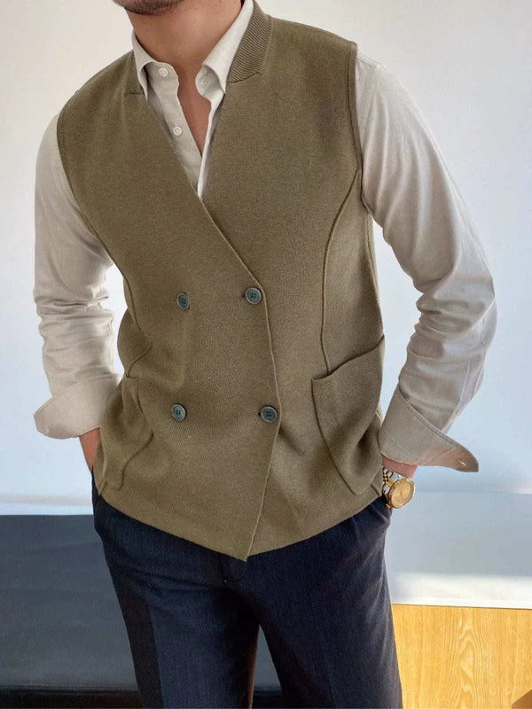 Man wearing Mr. Lusan's British slim fit wool vest in olive green with double buttons and side pockets over white shirt