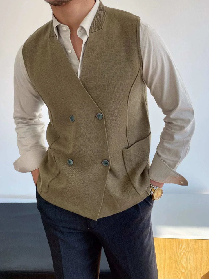 Man wearing Mr. Lusan's British slim fit wool vest in olive green with double buttons and side pockets over white shirt