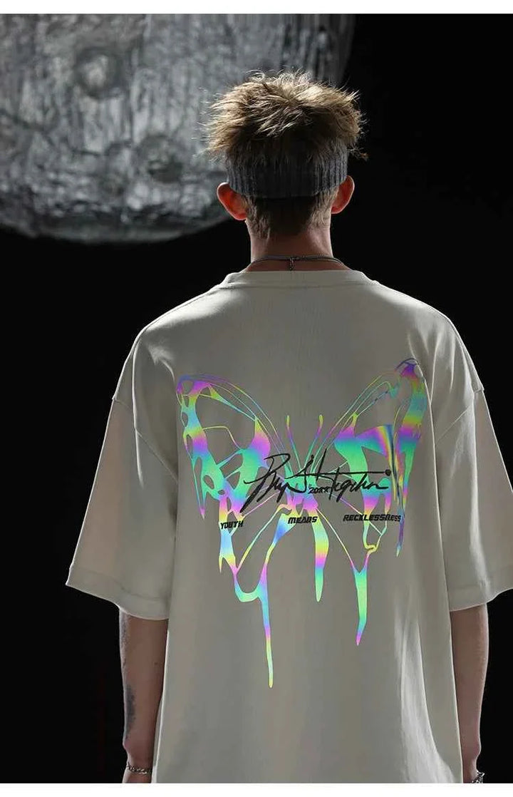 Back view of person wearing a reflective butterfly print modern youth T-shirt تيشيرت فراشة عاكس