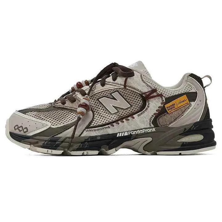 New Balance إصدار مخصص beige and brown sneaker with decorative beads on laces and PandaPrank logo, breathable mesh and synthetic leather, shock-absorbing sole.