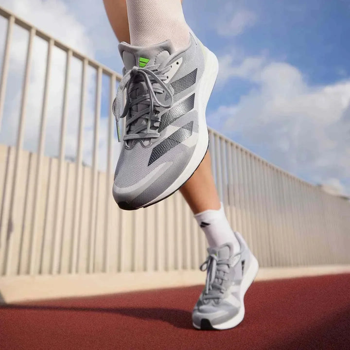 Adidas أديداس حذاء Adizero RC 4 رمادي خفيف الوزن للجري بتصميم شبكي ونعل متوسط نايلون مقاوم للانزلاق